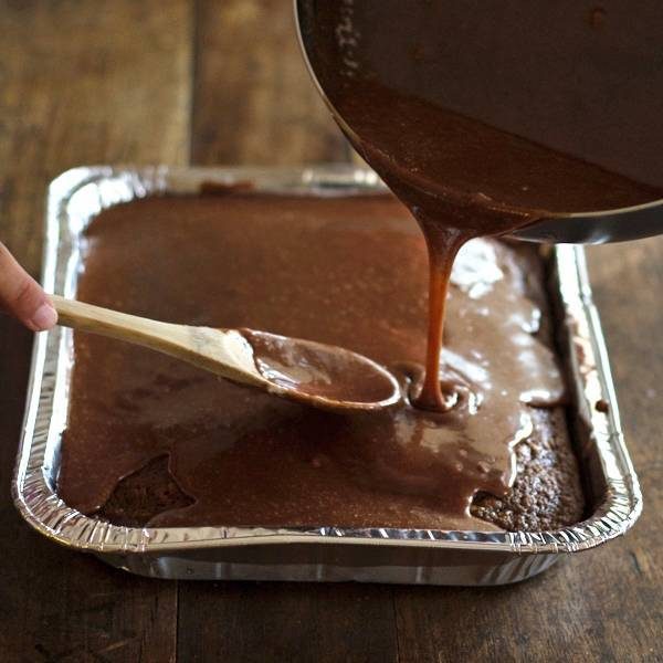 Chocolate drizzle over a cake.